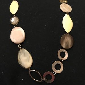 Gold-yellow toned long necklace.